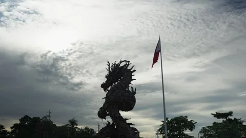 Philippines flag and dragon statue in Cebu, Philippines Stock Footage 325420673