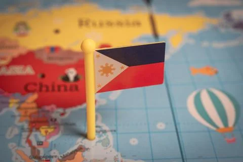 Philippines flag pin on world map with Asia and China background Stock Photos