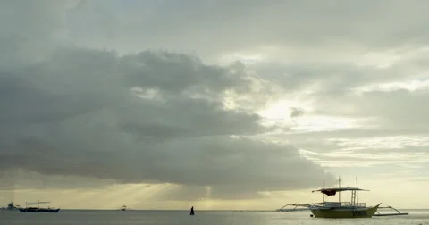 Philippines - Man walking in shallow water with clouds in the horizon Stock Footage 58938342