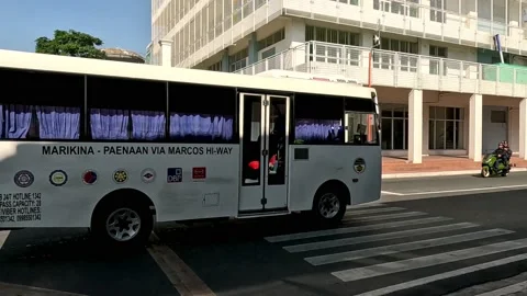 Philippines Mini Bus or Modern Jeepney infront of Marikina City Sport Center Stock Footage 235884469