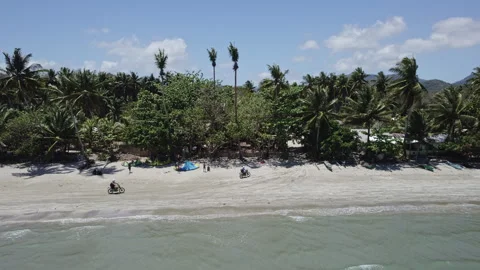 Philippines, Palawan, June 20 2024 Motorcycles riding on the beach Stock Footage 280495787