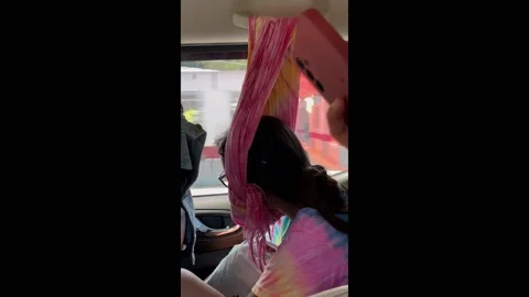 Philippines: Sleeping in style: creative head support on a road trip Video stock 288104750