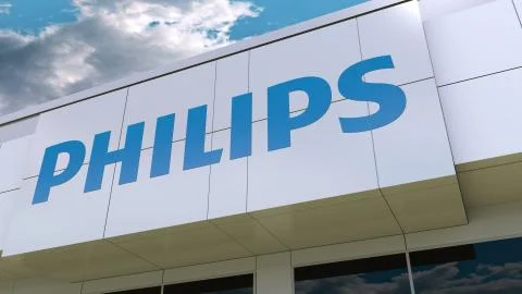 Philips logo on the modern building facade. Editorial 3D rendering 스톡 일러스트