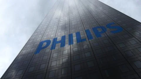 Philips logo on a skyscraper facade reflecting clouds. Editorial 3D rendering イラスト素材