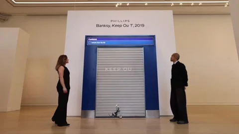 Phillips previews Banksy's 'Keep Ou T' installation prior to London auction, UK, Stock Footage 346709071