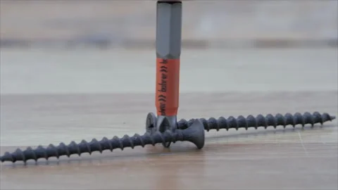 A phillips screwdriver, a bit, rotates and moves the roofing screws. worm gear Stock Footage 263986712