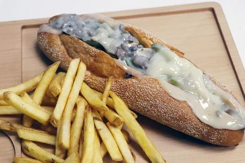 Philly cheese sandwich with angus beef and provolone cheese, served with pota Stock Photos