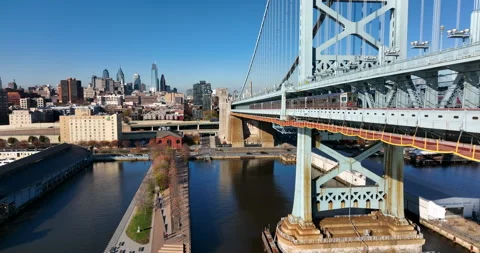 Philly SEPTA commuter rail train on Ben Franklin Bridge. Philadelphia to Stock Footage 167548118