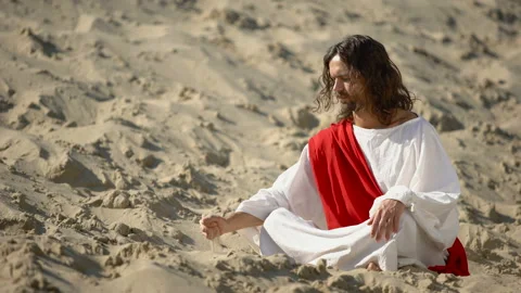 Philosopher pouring sand from hand in desert, reflecting on life and time Stock Footage 112632219