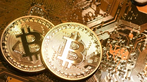 Phisical bitcoin over electronic circuit board. Stock Footage 95065966