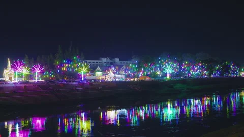 Phitsanulok Thailand riverside lights reflected on the river at night Stock Footage 343893426