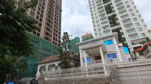 Phnom Penh Cambodia fast developing two tall skyscrapers under construction Stock Footage 231862625