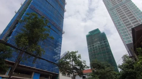 Phnom Penh Cambodia fast developing tall skyscrapers under construction Video stock 231862648