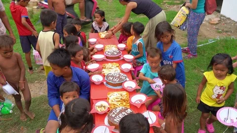 PHNOM PENH, CAMBODIA - JANUARY 2017: NGO school, Children eating Stock Footage 76512161