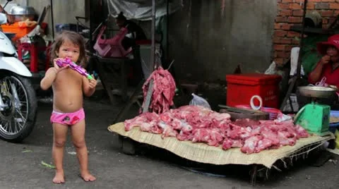 PHNOM PENH - JUNE 2012: local asian market butchers Stock Footage 12178055
