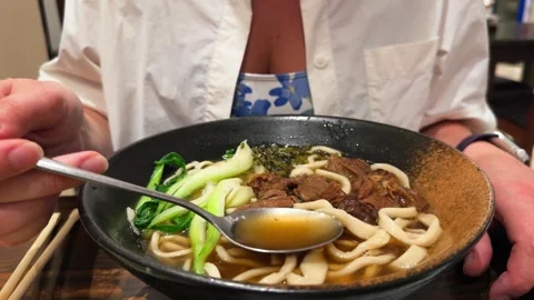 Pho bo is a Vietnamese dish made with rice noodles and beef. It is seasoned with Stock Footage 319894533