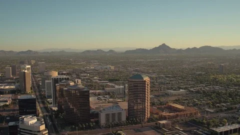 Phoenix Arizona Aerial v4 Flying low over downtown area panning sunset cityscape Stock Footage