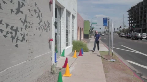 Phoenix AZ small office building with man walking in Stock Footage 40403046