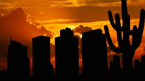 Phoenix Skyline with Saguaro Cactus, Time Lapse at Sunset with Red Sun Vídeo Stock 136427393