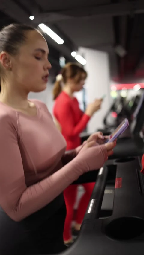 Phone addiction during workout Stock Footage 337956646