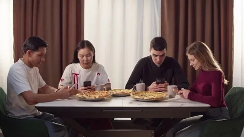 Phone addiction problem. People with mobile cellphone ignoring each other. Stock Footage 327712625