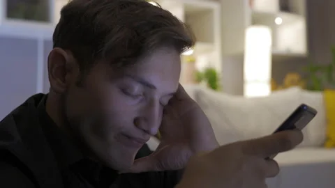 Phone addiction. Young man looking at phone and texting. Stock-Footage 220153998