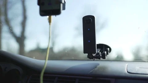 Phone and camera in the car moving on the road 스톡 동영상 85272038