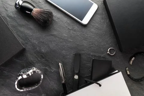 Phone and clock, gift boxes on a gray background free space Stock Photos