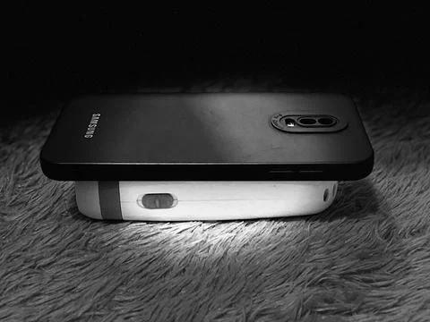 Phone and flashlight Stock Photos