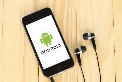 Phone with Android logotype on its screen Stock Photos