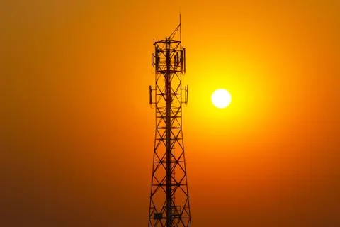 Phone Antenna Tower with a sunset background Silhouette-Evening light Photos