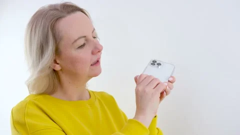 Phone Apple iPhone 13 pro max a woman puts on a transparent case on her Video stock 236951639