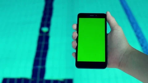 Phone on the background of swimming pool Stock Footage 81923073