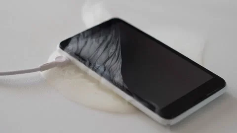 Phone battery fire while charging on desk, close-up, Mobile phone or smartp.. Stock Footage 293297869