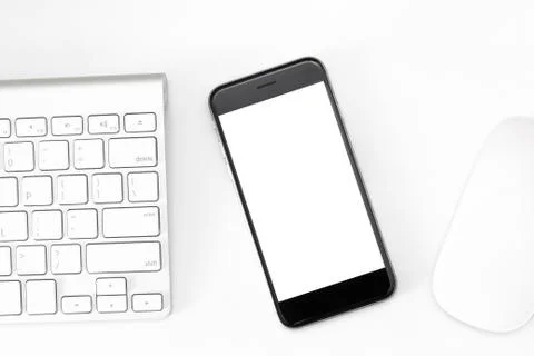 Phone blank screen on white work table Stock Photos