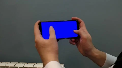 Phone with a blue screen, background for video and games, screen saver, man, Stock Footage 168472746