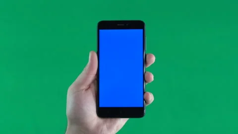 Phone with blue screen on hand, isolated on green background, vertically Stock-Footage 86807325