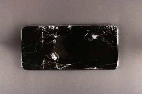 Phone with broken screen, cracks on the screen Stock Photos