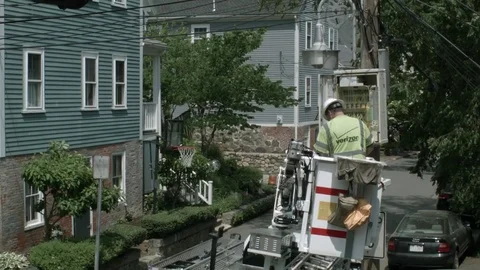 A Phone Cable Internet Utility Worker In A Bucket Lifted Up Closing An Electrica Stock Footage 76767508