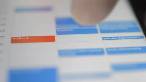 Phone calendar app for work planning. man's hand use google calendar app. Stock Footage 254780442