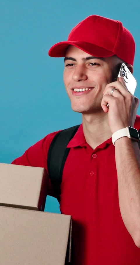 Phone call, boxes and delivery man in studio for communication, feedback or Stock Footage 343226614