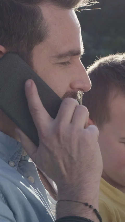 Phone call, kid and father outdoor for remote work, multitasking or play game on Stock Footage 327198997