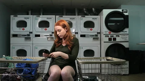 Phone call in laundry room 動画素材 1070062