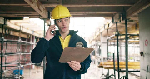 Phone call, man or engineer with clipboard at construction site, walking or Stock Footage 337015694