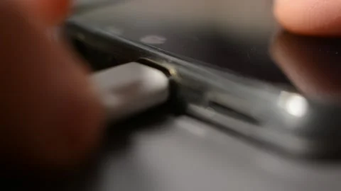 Phone charge energy with white cable. recharge energy power of iphone device. Video stock 302344330