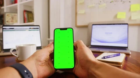 Phone with chroma key green screen, man working with chatbot AI online Stock Footage 316400401