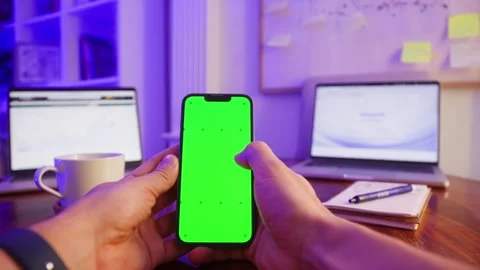 Phone with chroma key green screen, man working with chatbot AI online Stock Footage 327920431