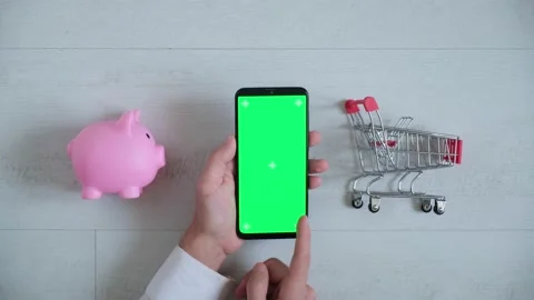 Phone with a chromakey screen in the hands of a close-up . top view smartphone 動画素材 141912825
