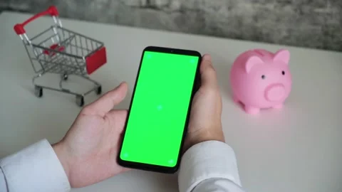 Phone with a chromakey screen in the hands of a close-up . top view smartphone Stock Footage 141913535