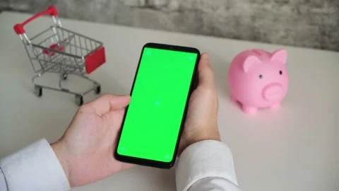 Phone with a chromakey screen in the hands of a close-up . top view smartphone Stock Footage 143527916